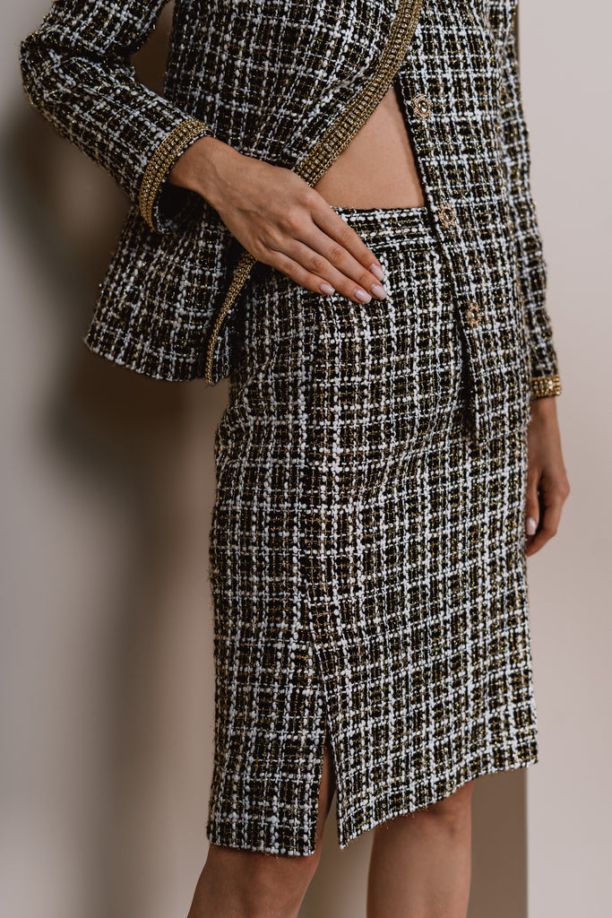 Front view of an elegant tweed pencil skirt in black by Anastasiia Ivanova fashion designer 