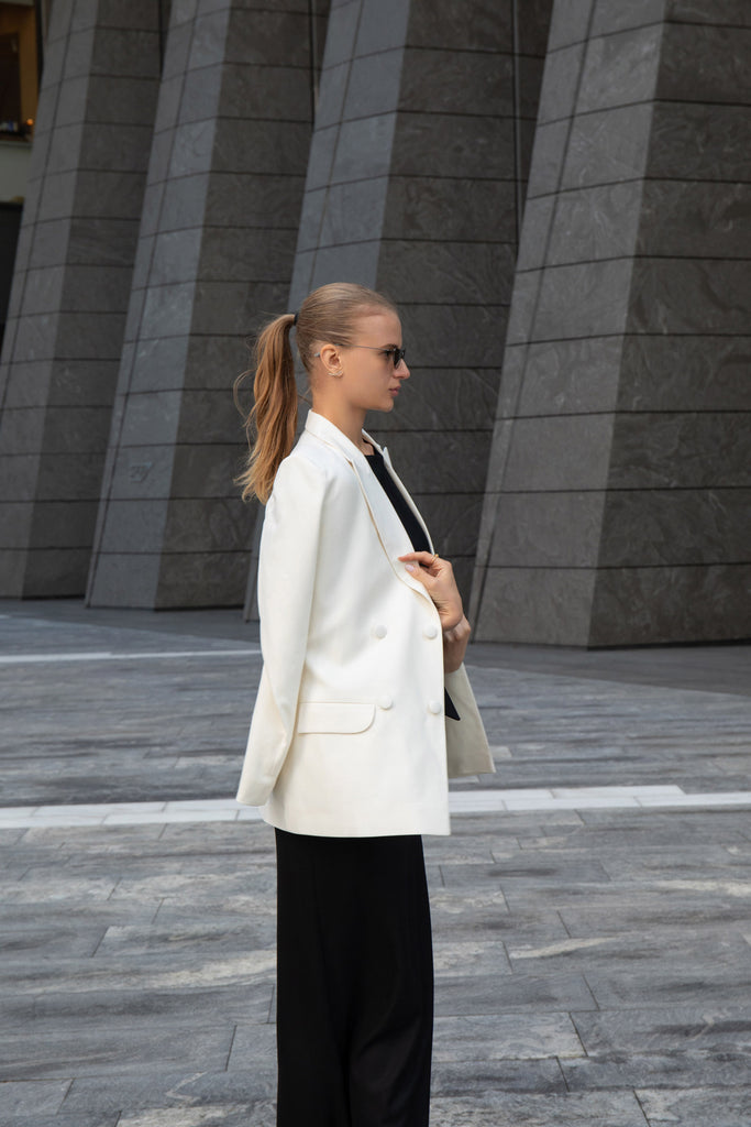 White blazer with black dress by Anastasiia Ivanova, elegant contrast street style look