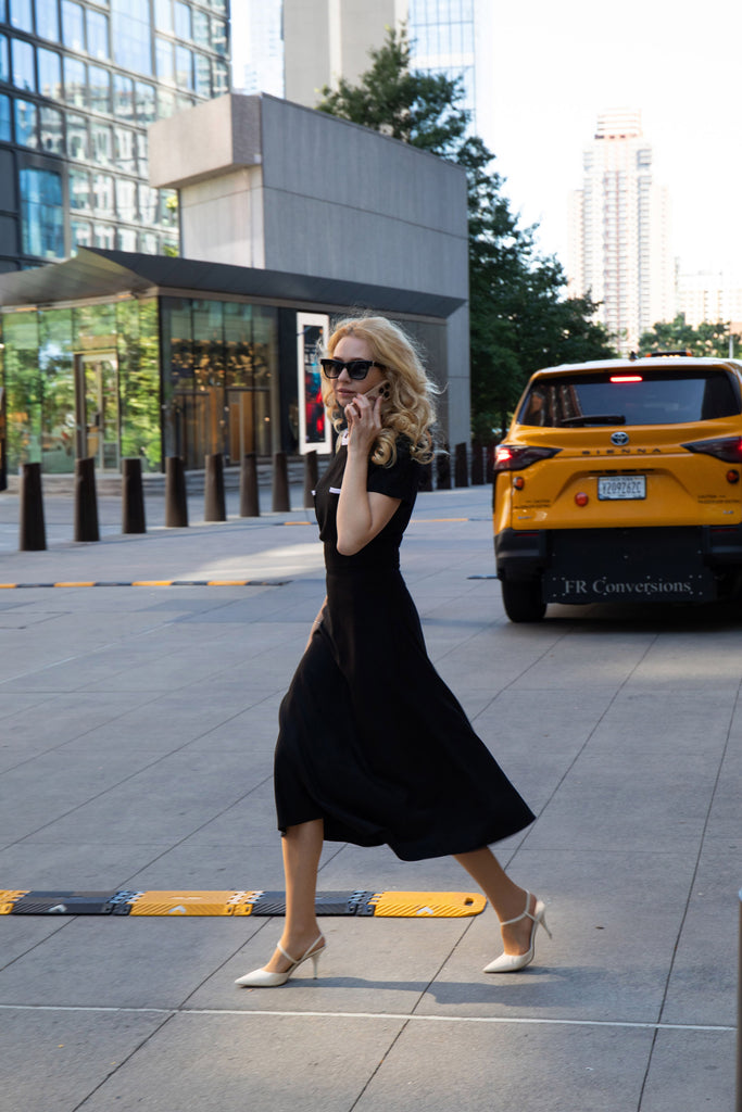 Black midi dress with white details by Anastasiia Ivanova, elegant street-style photo in New York