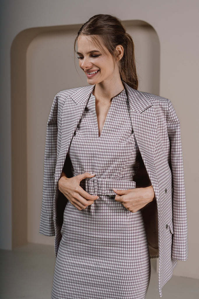 Close-up of neckline and shoulder detail on pastel lilac business dress