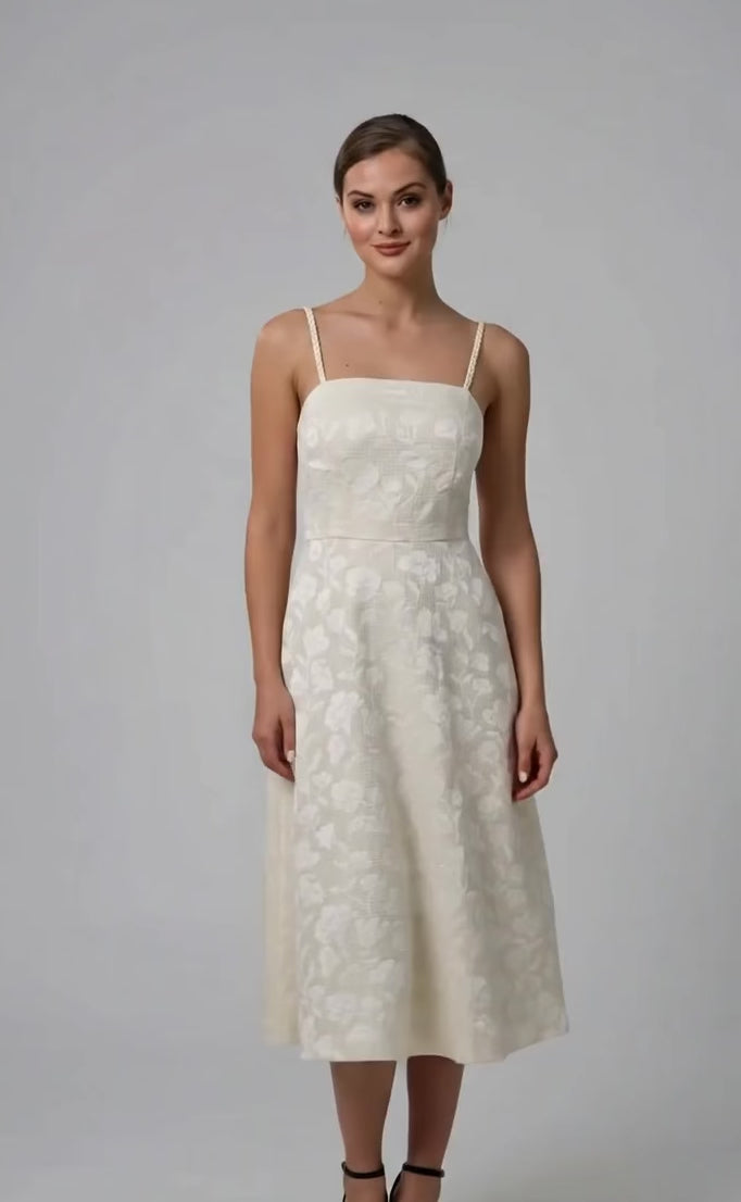 Video lookbook of a vanilla cream jacquard midi dress by Anastasiia Ivanova. The footage highlights the beautiful flared silhouette, square neckline, and artisanal braided straps, making it an ideal choice for a sophisticated court wedding or civil ceremony.