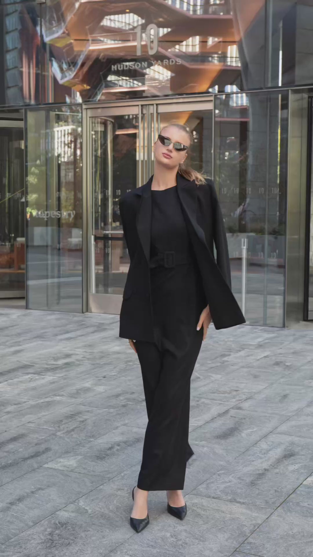 Elegant street-style video featuring black and white blazers by Anastasiia Ivanova, styled with a long black dress on the streets of New York — a visual story of timeless sophistication and modern femininity.