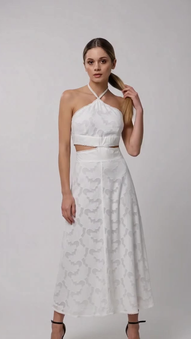Video showcasing the fluid drape and elegant details of ANASTASIIA IVANOVA white textured silk cutout midi dress, a perfect minimalist bridal gown alternative